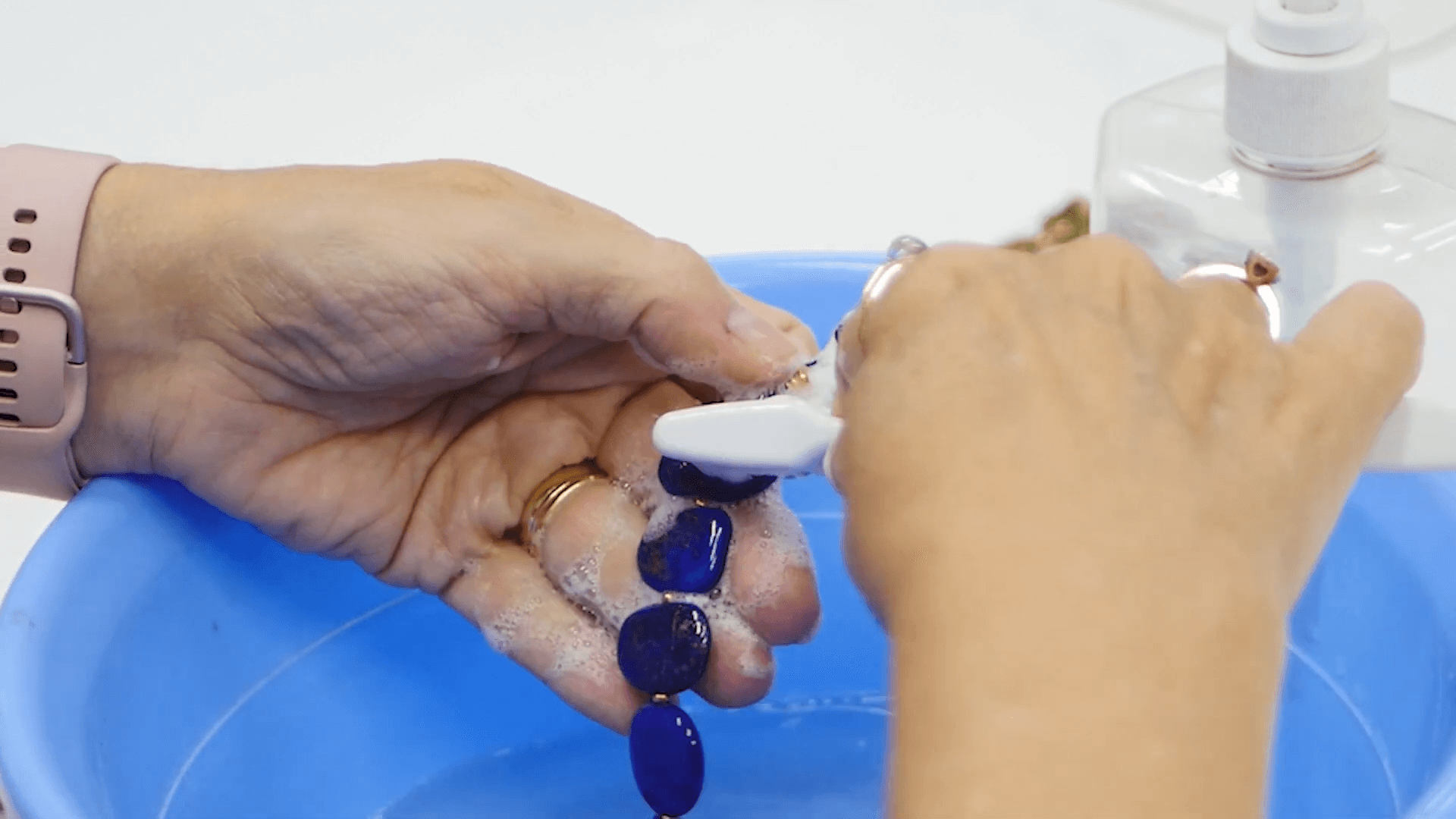 dipping and wetting a necklace