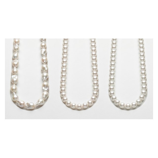 Three pearl strands compared: baroque natural, round cultured, and uniform imitation pearls