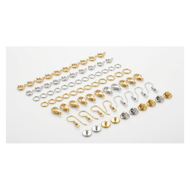 An assortment of jewellery findings — clasps, jump rings and ear wires in gold and silver