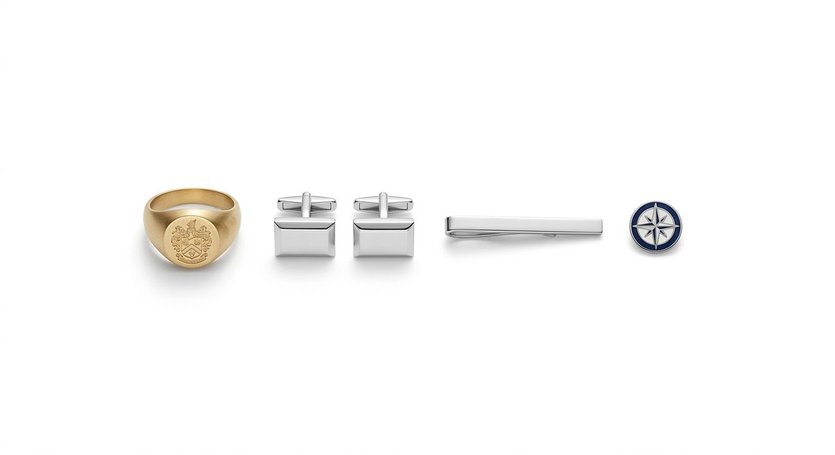 Men's jewellery: a signet ring, cufflinks, a tie bar and a lapel pin