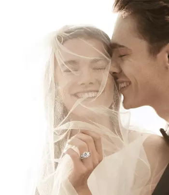 Picture of a bride and groom happy and wearing stunning jewellery